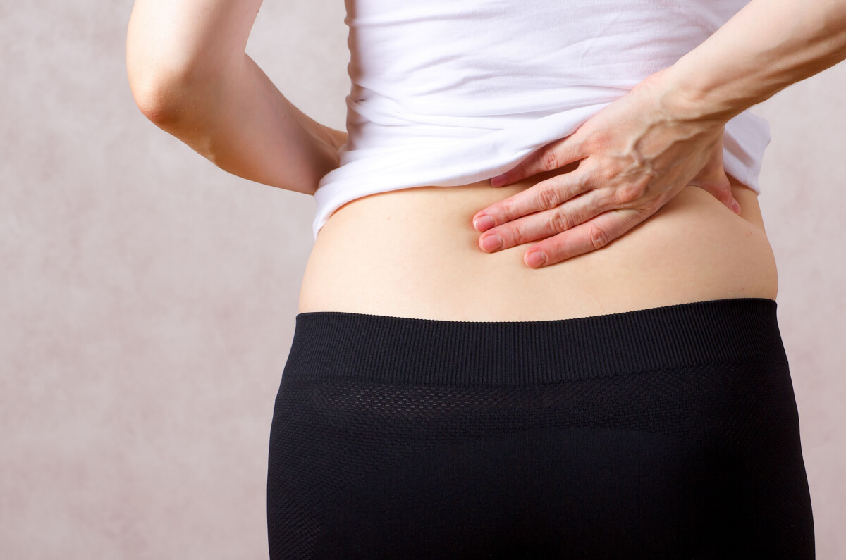 woman postpartum back pain