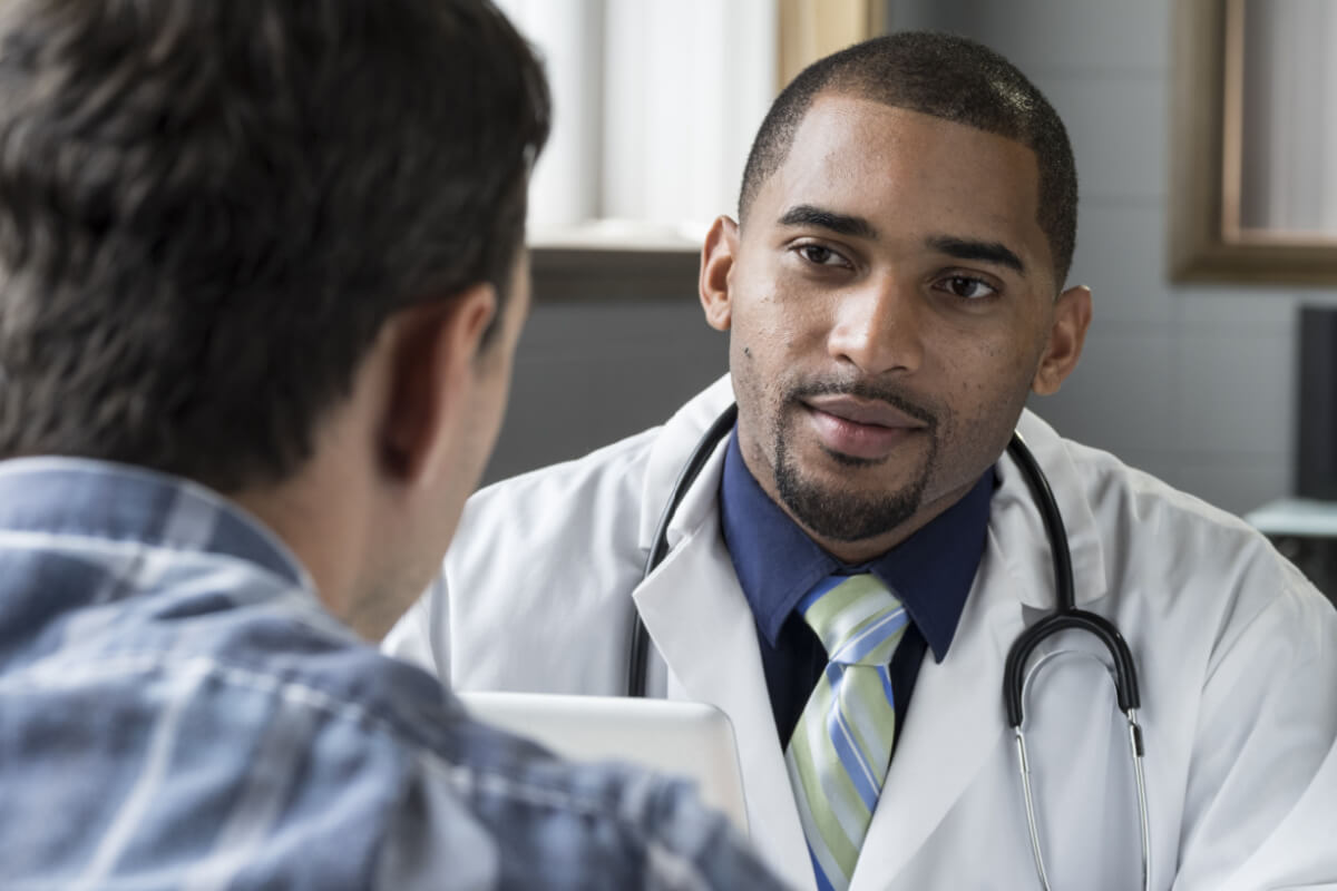 doctor consulting male patient