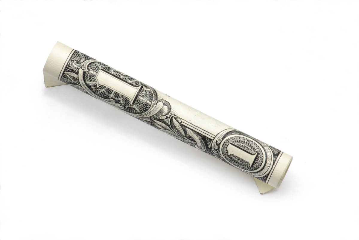 one dollar rolled bill white background