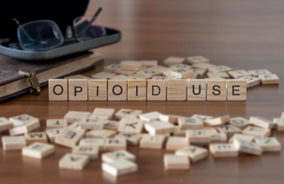opioid use represented by wooden letter tiles