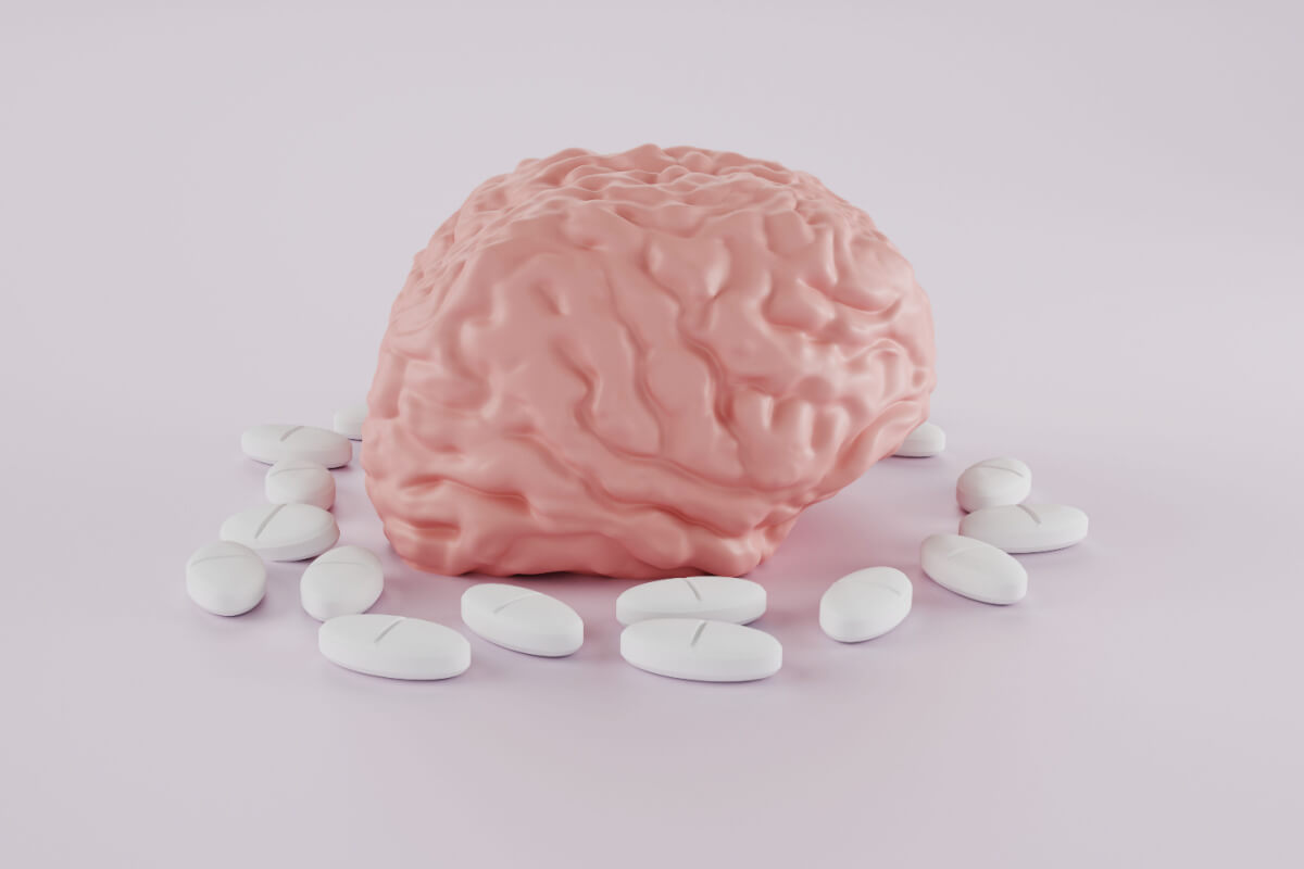 human brain surrounded by pills